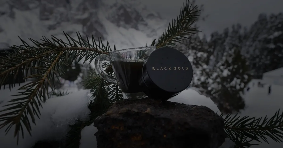 A Black Gold jar and a glass of dissolved salajeet on a snowy mountain slope